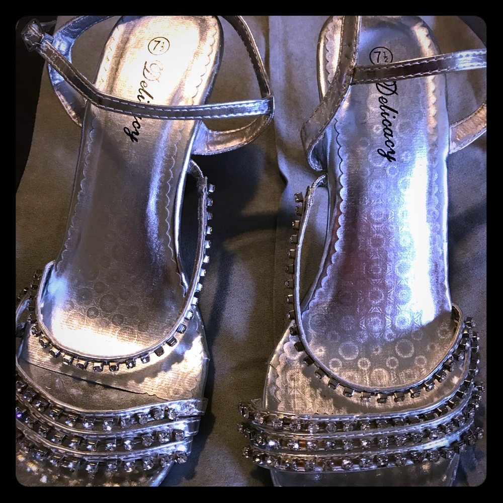 Silver dressy heels with sparkling rhinestones.